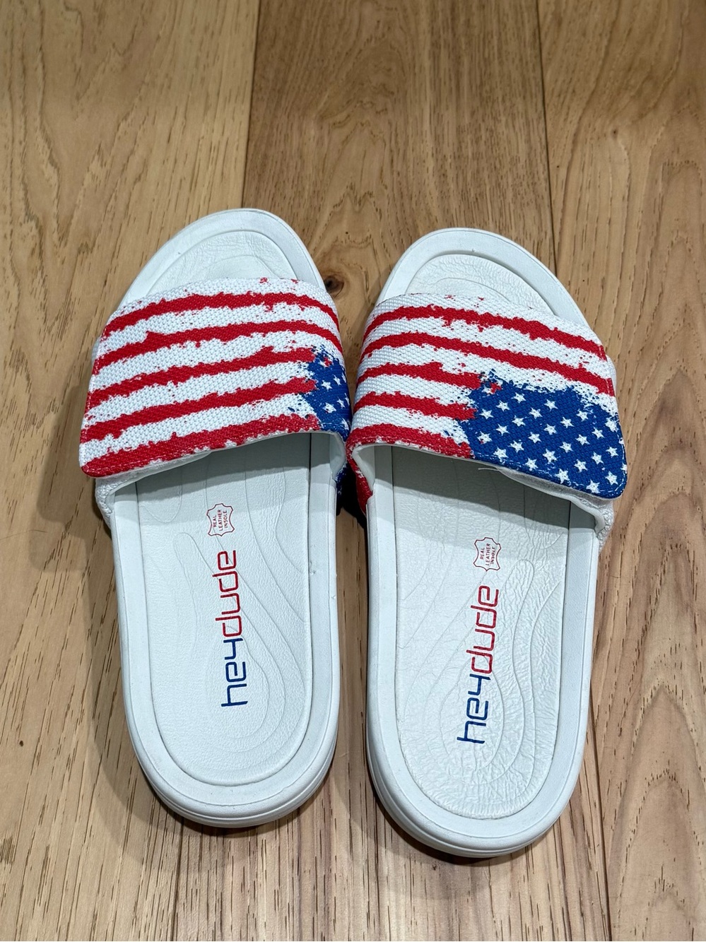Hey Dude mens Americana Slide Sandals - White with Red & Blue Stars/Stripes